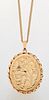 A 9 CARAT GOLD LOCKET PENDANT ON CHAIN, the oval locket foliate engraved an