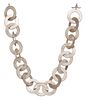 A SILVER NECKLACE, formed of large textured hoop links, to a T-bar fitting,