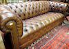A tan leather upholstered Chesterfield sofa, 217 x 90cm <br> <br>