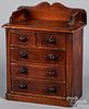 Miniature stained pine doll chest of drawers