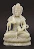 A jade Bodhisattva,<BR>20th century, the pale grey-green stone goddess seated cross-legged on a lotu