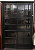 Contemporary China Cabinet, having two sliding doors opening to interior shelving, height 78 inches, width 49 inches.