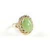 A 14K YELLOW GOLD AND GREEN JADE RING, 