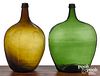 Two emerald and olive green glass demijohn bottles