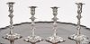 Two pairs of Georgian style silver candlesticks