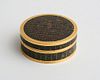 CONTINENTAL GILT-METAL INLAID AND BANDED LACQUER CIRCULAR BOX AND COVER