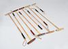 GROUP OF EIGHT BAMBOO AND WOOD POLO MALLETS, USED BY WINSTON F. C. GUEST
