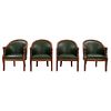 Lote de 4 sillones. Francia, siglo XX. Elaborados en madera con tapicería de piel color verde. Respaldos cerrados, asientos ac...