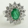 Lady's 1.60 Carat Oval Cut Emerald, 1.45 Carat Round Cut Diamond and 14 Karat White Gold Ring