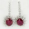 Pair of Lady's 14.15 Carat Oval Cut Ruby, 1.80 Carat Gold Earrings.