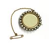 A gold and silver, split pearl set brooch,