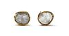 A pair of gold foil-backed diamond stud earrings,