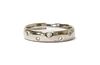 An 18ct white gold diamond set wedding ring,
