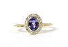 A gold tanzanite and diamond cluster ring,