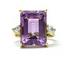 An 18ct gold amethyst and diamond three stone ring,