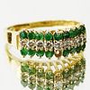 Lady's Emerald, Diamond and 14 Karat Yellow Gold Ring.