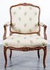 * A Louis XV Style Walnut Fauteuil Height 38 inches.