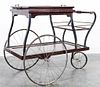 * A Wood, Glass and Bronze Bar Cart. Height 31 inches.