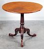 A Chippendale Style Mahogany Tilt-Top Table Height 28 1/2 x diameter 31 inches.