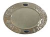 An Arts and Crafts silver-plated oval wall mirror,