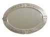 An Arts and Crafts silvered copper wall mirror,