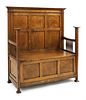 An Arts and Crafts oak settle,