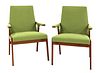 A pair of teak armchairs,
