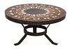 A circular tile-topped coffee table,