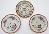 Three Chinese Porcelain Plates
to include a Famille Rose plate having painted enameled green dragons and red border
18th century
signed on bottom 
alo