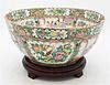 Large Rose Medallion Punch Bowl decorated with mandarin panels and detailed butterfly and flower border on wooden base 2012 Tucker Frey Antiques Recei