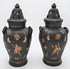 Pair of English Decoupage Vases with Covers
black painted pottery having dome cover with vents, opening to flat lid cover, rope handles and decoupage 