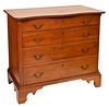 Chippendale Cherry Four Drawer Chest
having serpentine top over four drawers with fluted columns set on cut out bracket feet
circa 1780
height 34 inch