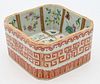 Chinese Famille Rose Porcelain Square Dish
interior painted in nine panels with wild flowers, exterior painted with iron red geometric dragon design, 