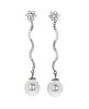 Pair of long detachable earrings with movement in 18kts white gold