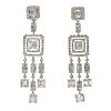 Pair of long earrings with movement made in 18kt white gold,