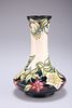 A MOORCROFT POTTERY VASE, by Nicola Slaney, tubelined and hand-painted with