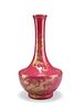 A CHINESE RUBY RED GLAZED VASE, bottle-shaped, gilded with birds perched up