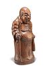 A CHINESE HARDWOOD FIGURE, QING DYNASTY, carved as an elder, holding a stic