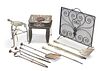 A COLLECTION OF COUNTRY HOUSE METALWORK, including fender, irons, trivet, f