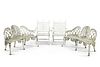 A PAIR OF WHITE PAINTED CAST IRON GARDEN BENCHES, each with pierced shell a