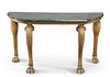 A CARVED AND GILDED MARBLE-TOPPED CONSOLE TABLE, PROBABLY IRISH, the painte