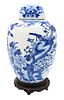 Chinese Blue and White Baluster Jar with Cover having bright white glaze and blue painted wild flower decoration, finely trimmed glazed edges 