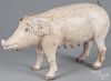 Carved and painted pig with a wrought iron tail and leather ears, 11'' h., 19'' w.