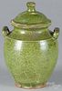 Green glaze redware lidded jar, 19th c., probably Continental, 8 1/4'' h.