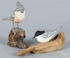 Robert Hogg, two carved birds, painted by C. X. Carlson, mounted on driftwood bases, signed