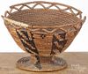 Native American Indian footed basket, early 20th c., probably Apache, 7'' h.
