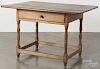 New England pine and cherry tavern table, ca. 1800, 26'' h., 40 1/2'' w.