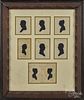 Set of seven hollowcut silhouettes of a family, 19th c., all mounted in a period carved frame