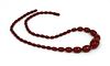 A single row graduated cherry coloured Bakelite bead necklace,