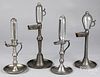 Four pewter whale oil clock lamps, 20th c.